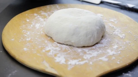 Putting formed bread on the paper Stock Footage 121120778