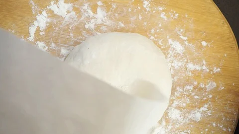 Putting formed bread on the paper overhead Stock Footage 121120182