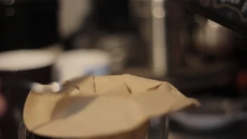 Putting Fresh Ground Coffee Into a Coffee Filter Stock Footage 85991925