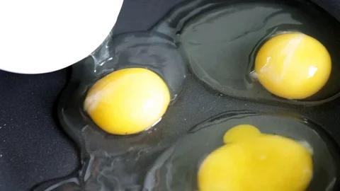 Putting fried eggs from a hen's egg Stock Footage 78733773