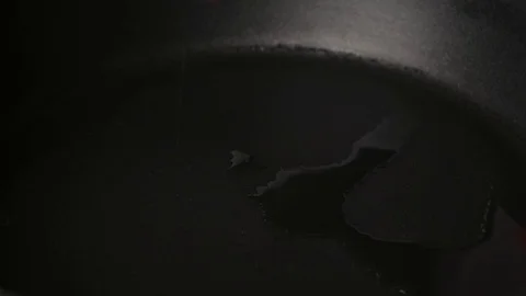 Putting frozen vegetables to pan. Stock Footage 71134036