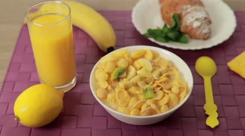 Putting fruits into cereal bowl. Healthy breakfast Stock Footage 59604238