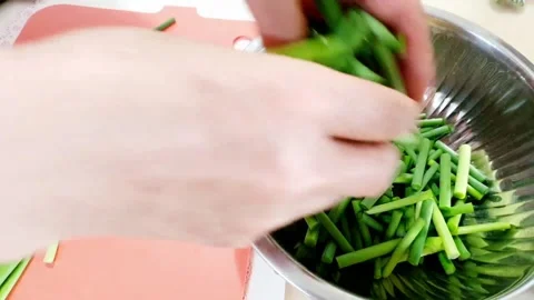 Putting garlic stems Stock Footage 205419279