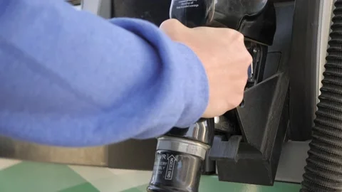 Putting Gas Pump Nozzle Back On Pump Stock Footage 220587582