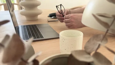 Putting on glasses and starting work in home office Stock Footage 334042271