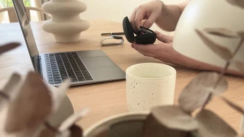 Putting glasses into case after work in home office Stock Footage 334042268