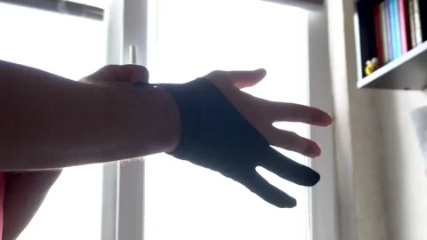 Putting on the glove Stock Footage 325988491