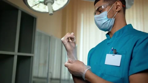 Putting on Gloves Video stock 151786122