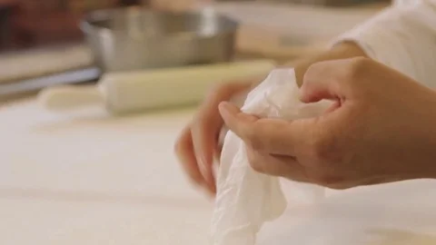 Putting gloves on - kitchen Stockbeeldmateriaal 77761644