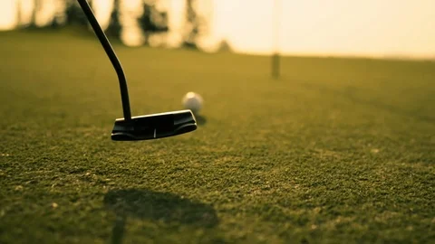 Putting Golf Ball on green in golf course hitting the golf ball to hole Stock Footage