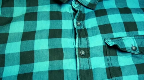 Putting green shirt on a table Stock Footage 68375134