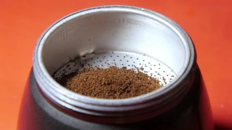 Putting ground coffee Stock Footage 68538197