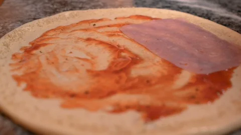 Putting ham on pizza Stock Footage 86279099