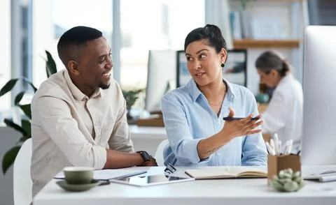 Putting in the hard work to meet objectives. two businesspeople working together Stock Photos
