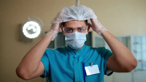 Putting on a hat and protective glasses before operation Video stock 151786043