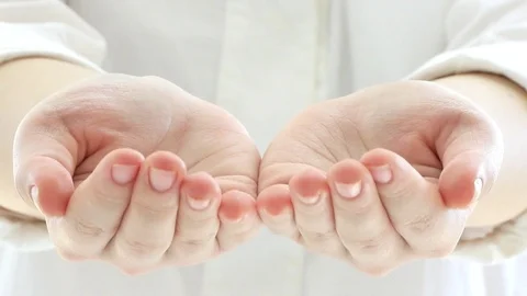 Putting her hands together and showing them towards camera : creative concept Stock Footage 81377169