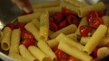 Putting Herbs on a Cooking Pasta Stock Footage 86128228