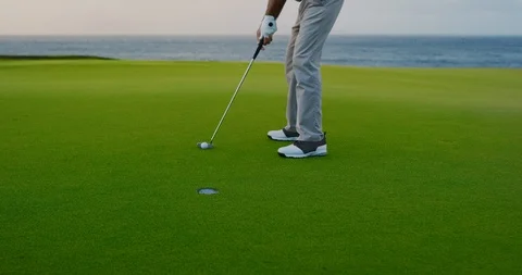 Putting into the hole Stock Footage 102410246