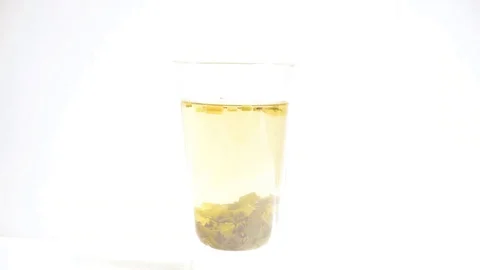 Putting honey into tea Stock Footage 129767750