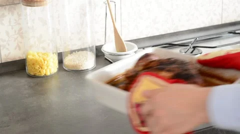 Putting hot, crispy, oven roasted chicken on table. Stock Footage 48922760