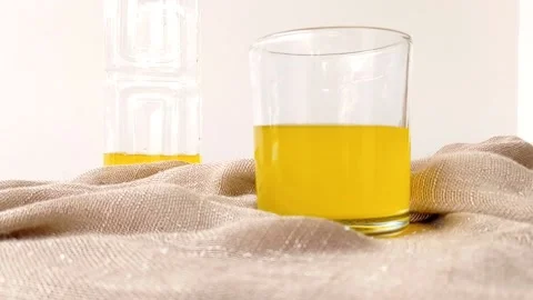 Putting an ice cube into a glass Stock Footage 146251530