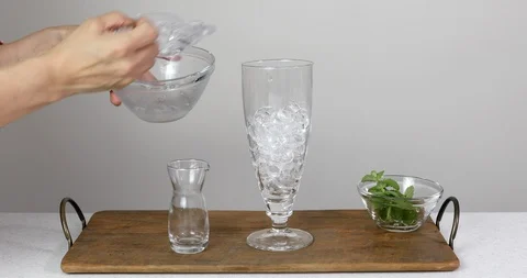 Putting ice cubes to make summer iced beverage Stock-Footage 112038228