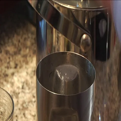 Putting Ice in Martini Shaker Stock Footage 69528144