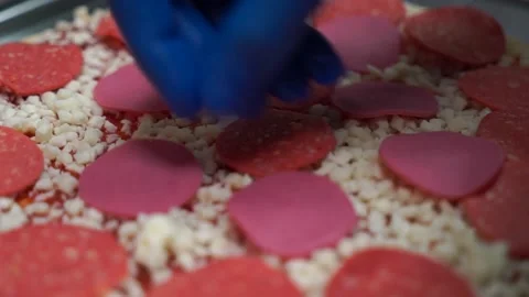 Putting ingredients on pizza close-up Stock Footage 187163872