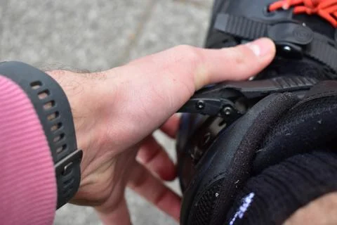 Putting on inline roller blades Stock Photos