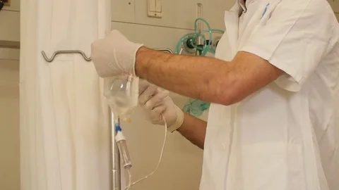 Putting Intravenous on a stand Stock Footage 72302498
