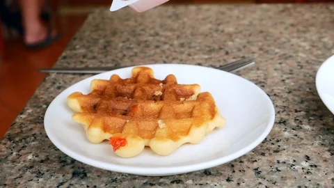 Putting on jam on waffle Stock Footage 114751775