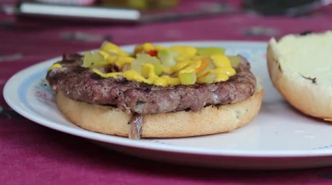 Putting Ketchup On A Hambuger Stock Footage 52671273