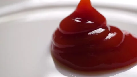 Putting ketchup on a white plate Stock Footage 55756962