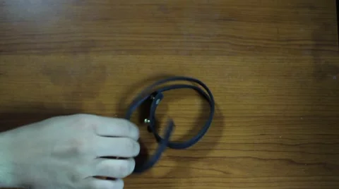 Putting On The Leather Bracelet On The Hand Stock Footage 65252359