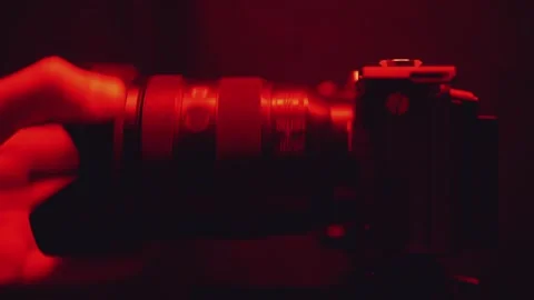 Putting the lens on the camera, installing the lens on the camera Stock Footage 310379240