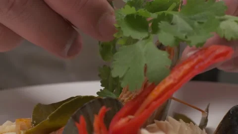 Putting lime on sushi with daikon, lemon slices Stock Footage 213470720