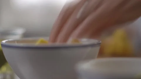 Putting mango and ginger root into blender cup, blending fruits Stock Footage 194478578