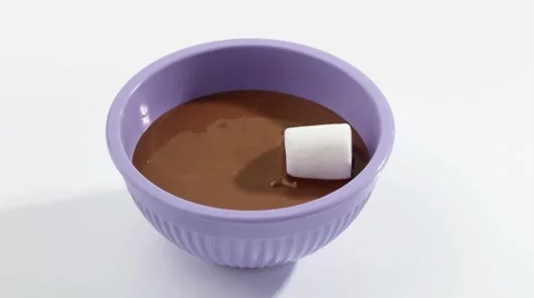Putting marshmallows into melted couverture chocolate Video stock 8571513