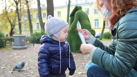 Putting on a mask Stock Footage 142265759