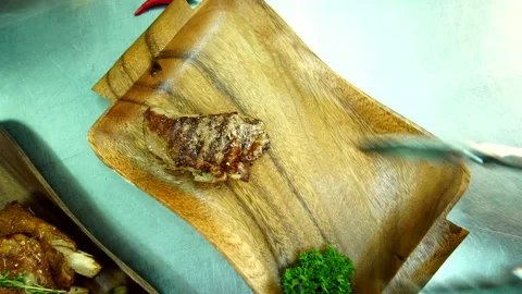 Putting meat on the board Stock Footage 140267311