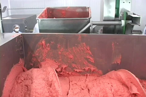 Putting meat in to mixer Stock Footage 128718