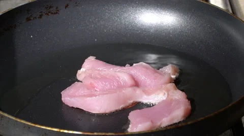 Putting meat on a pan Stock Footage 58822058
