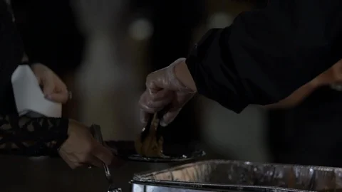 Putting Meat on Plate Stock Footage 104061099