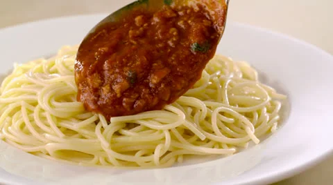 Putting meat sauce on spaghetti, Slow Motion Stock Footage 31819609