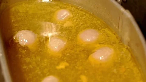 Putting meatballs in the sauce Stock Footage 273040855
