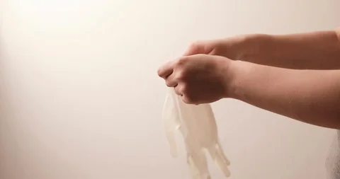 Putting on medical gloves Stock Footage 126548645