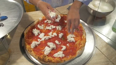 Putting mozzarella cheese on pizza Stock Footage 71540284