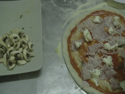 Putting mozzarella cheese on pizza with hands 13 Stock Footage 80674625