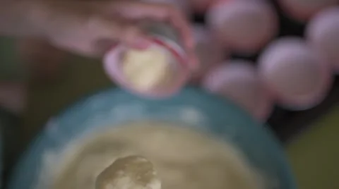 Putting muffin dough into cup Stock Footage 48854124