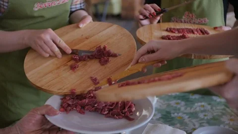 Putting multiple raw meat pieces into the dish Video stock 75393903